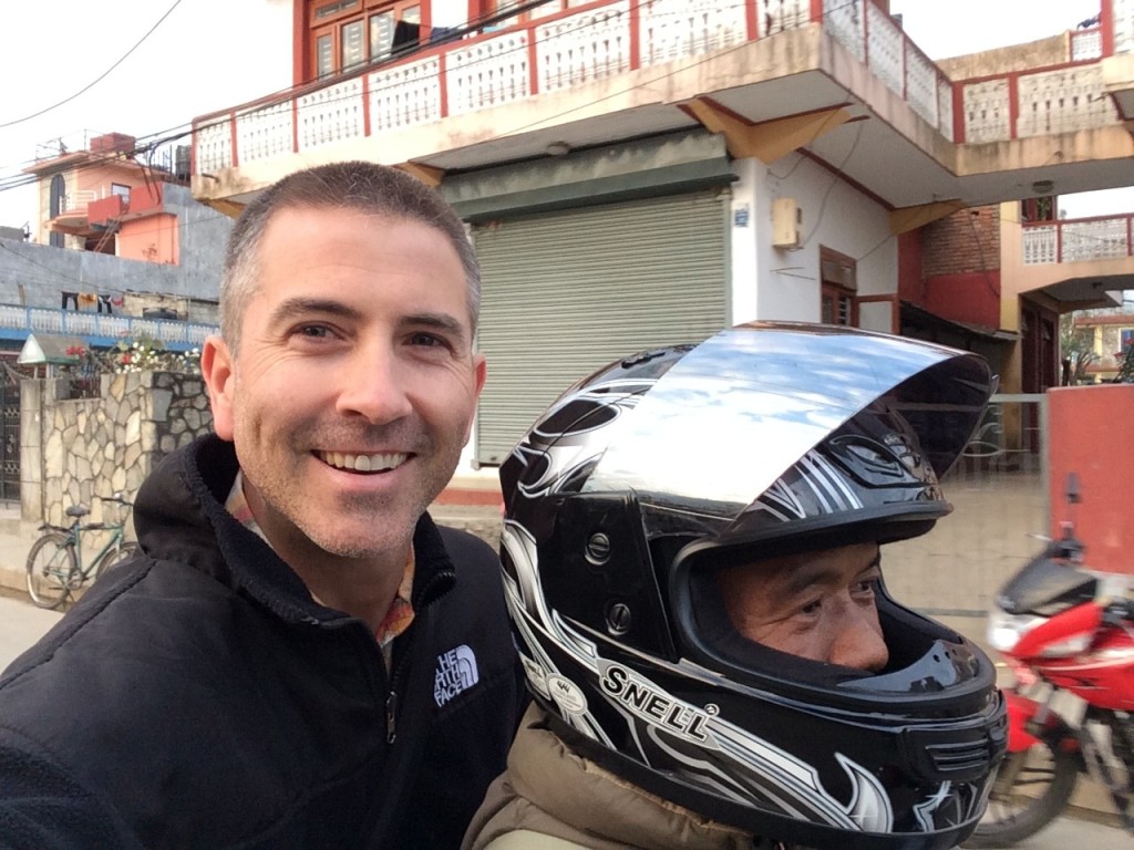 Taking a ride with a pastor in Pokhara to see his new building underway.